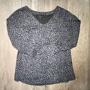 Grey leopard print blouse with ruffle detail and button-up front. Size: S